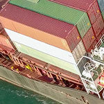 Thumbnail: Large Cargo and RoRo (Roll On-Off) ship at sea, loaded with a small amount of shipping containers